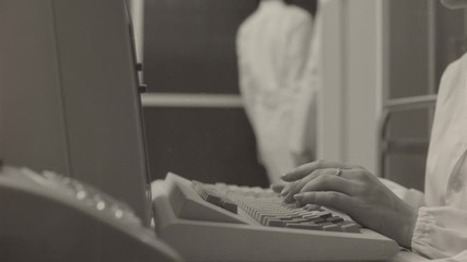 Female scientist working with a computer in the lab