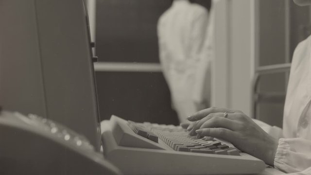 Female scientist working with a computer in the lab
