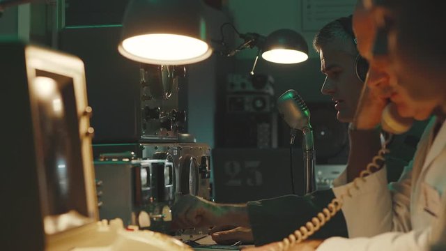 Vintage sci-fi scientists working in a operation room