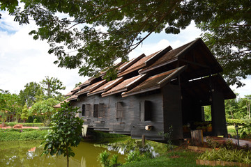 Kanchanaburi, Thailand, 09.09.2019: Beautiful garden, lake, traditional Thai, Siamese clothes, buildings of 