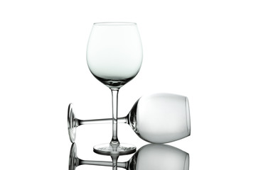 Clean Empty wine glasses with reflections on white background. Alcohol beverage card backdrop.