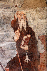 Sant'Antonio abate; affresco esterno su una vecchi casa a Cavalese, Trentino