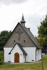 Fototapeta na wymiar Small chapel church in Vakwerk half-timber architecture in the Sauerland region