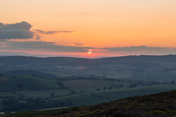 Red Sunset over British Countryside Fields