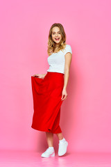 Beautiful woman studio red skirt