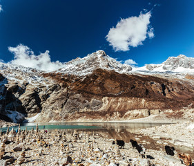 Snow covered mount Manaslu peak and lake in Himalayas,  Nepal.