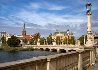 Obraz premium A view on the center of Schwerin, Mecklenburg State Theatre and the Schwerin Cathedral. Germany