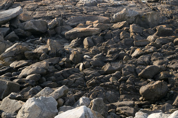 Rocks carved by sea water erosion. Stones texture and background. Rock texture