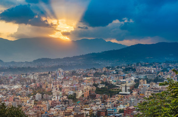 Fototapeta na wymiar Panoramic view of city buildings in Kathmandu and colourful sunset in capital of Nepal.
