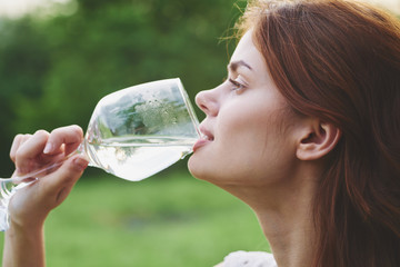 young woman with glass of water