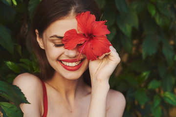 Cheerful woman exotic flowers