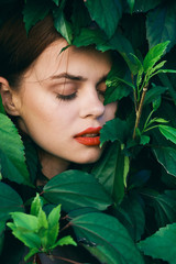 Beautiful woman green leaves nature