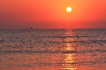 a beautiful sunrise seen from the sea beach