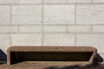 granite gray bench during the sunny day of trees near city hal of Ottawa, Canada