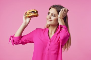 Woman holding a hamburger