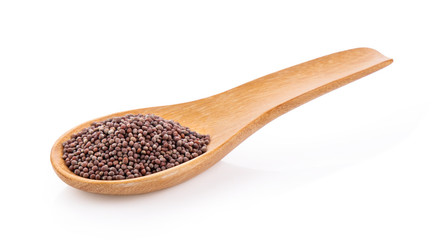 mustard seeds in wood spoon  isolated on white background