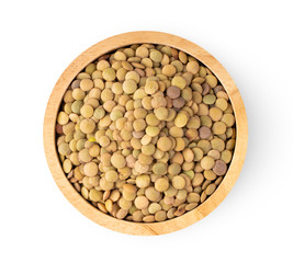 lentils in wood bowl  isolated on white background. top view