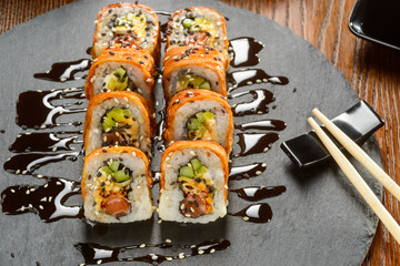 Sushi rolls sprinkled with sauce