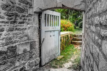 Entrance to a garden with colour offset against black and white
