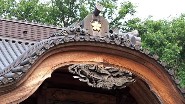 Japanese temple crest and wooden sculpture