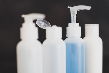 beauty lotions and moisturizers bottles with only one being colorful