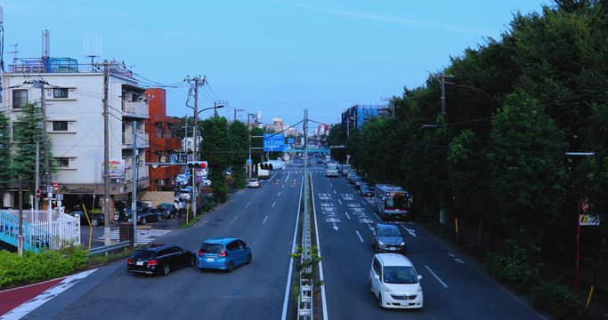 A downtown street at Kanpachi avenue in Tokyo daytime wide shot