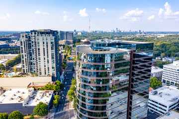 Aerial view picture of downtown Atlanta skyline and downtown Buckhead on the background