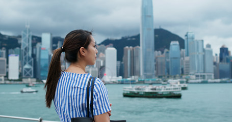 Woman look at the city view in Hong Kong