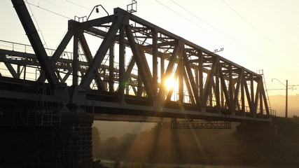 Fototapeta na wymiar Drone view Double railway bridge over river in morning fog