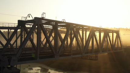 Drone view Double railway bridge over river in morning fog
