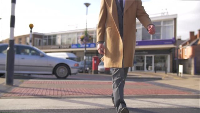Slow motion businessman entrepreneur man in Suit walking commuting to city work 