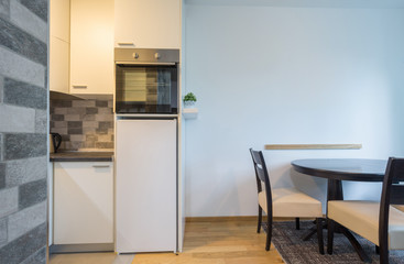 Kitchen interior with dining area in renovated apartment