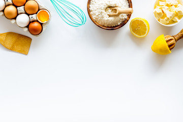 Baking background. Dough ingredients on white background top view copy space