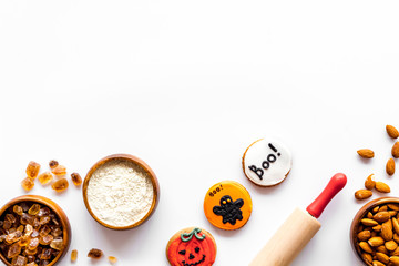 Cooking creepy cookies concept with almonds, pin, flour on white background top view mock-up