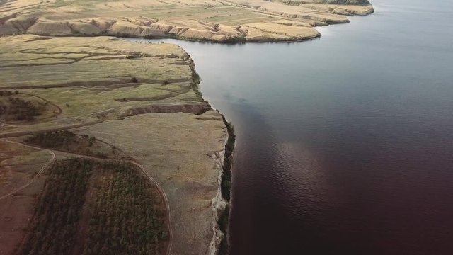 Top view on the Big lake and green fields