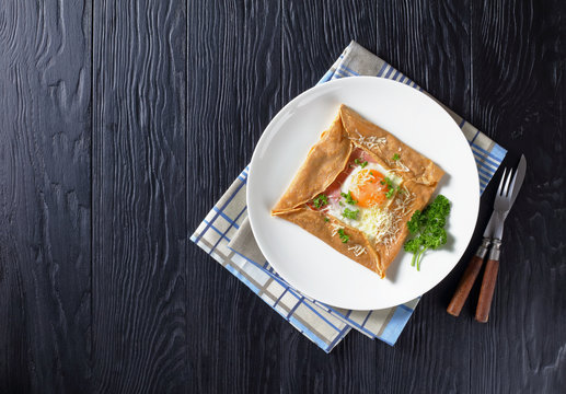Breton crepe on a white plate, top view