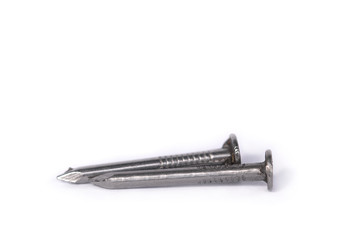 Steel nails with sharp ends close-up on a white isolated background. Macro sharp nails.