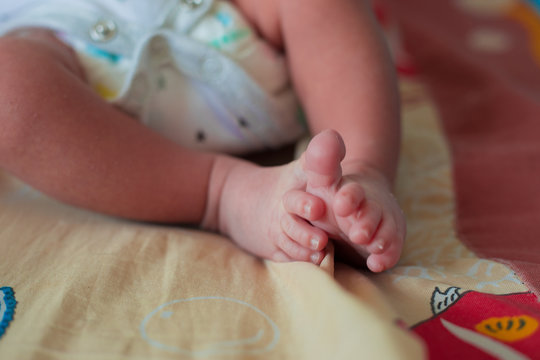 the baby's feet, the feet of the new born child