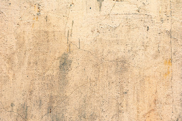 Texture of a concrete wall with cracks and scratches which can be used as a background