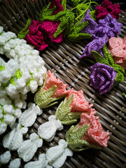 Garland of flowers from knitting with yarn