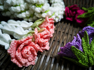Garland of flowers from knitting with yarn