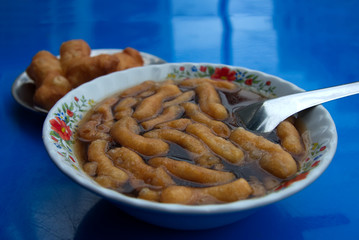 Fried dough on a ginger drink surface, Thailand