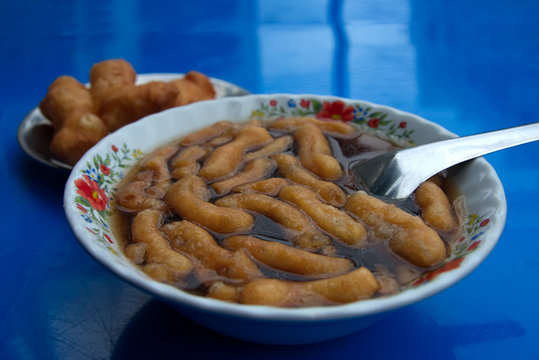 Fried dough on a ginger drink surface, Thailand