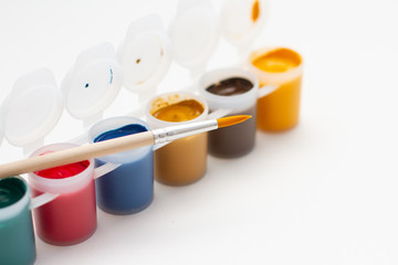 multicolored gouache and paint brush