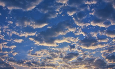 Naklejka na ściany i meble clouds in the shades of the sunrise