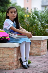 Smiling Young Filipina Girl Student With Books