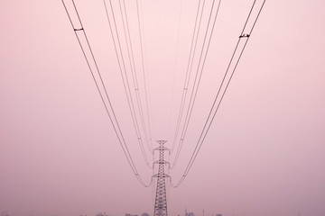 High Voltage Power Lines Pole on sunset scene background