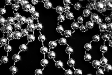 Christmas decoration on a dark surface close up black and white. Abstract background