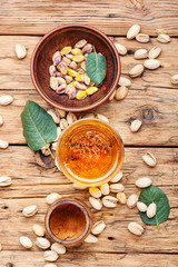 Pistachios nuts on wooden table