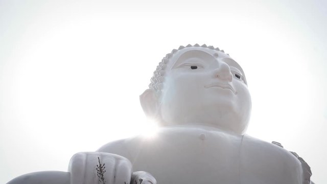 White buddha statue located in Thailand